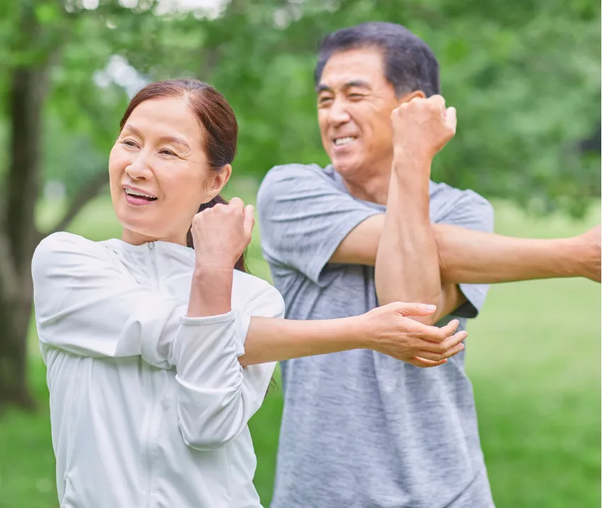 Man and Woman stretching Outdoors